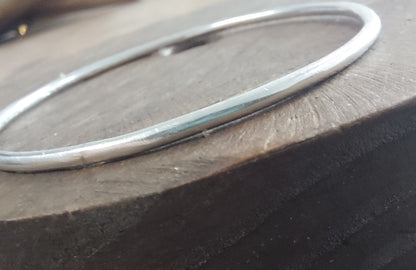 Silver bracelet on a wooden surface