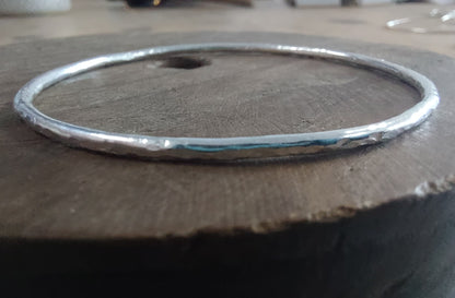 Dappled bangle bracelet on wood