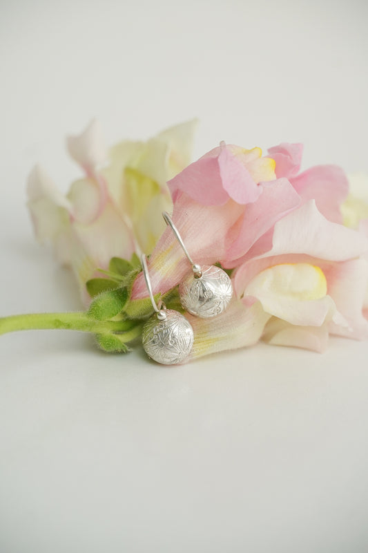 Freesia - tiny domed silver earrings or large domed